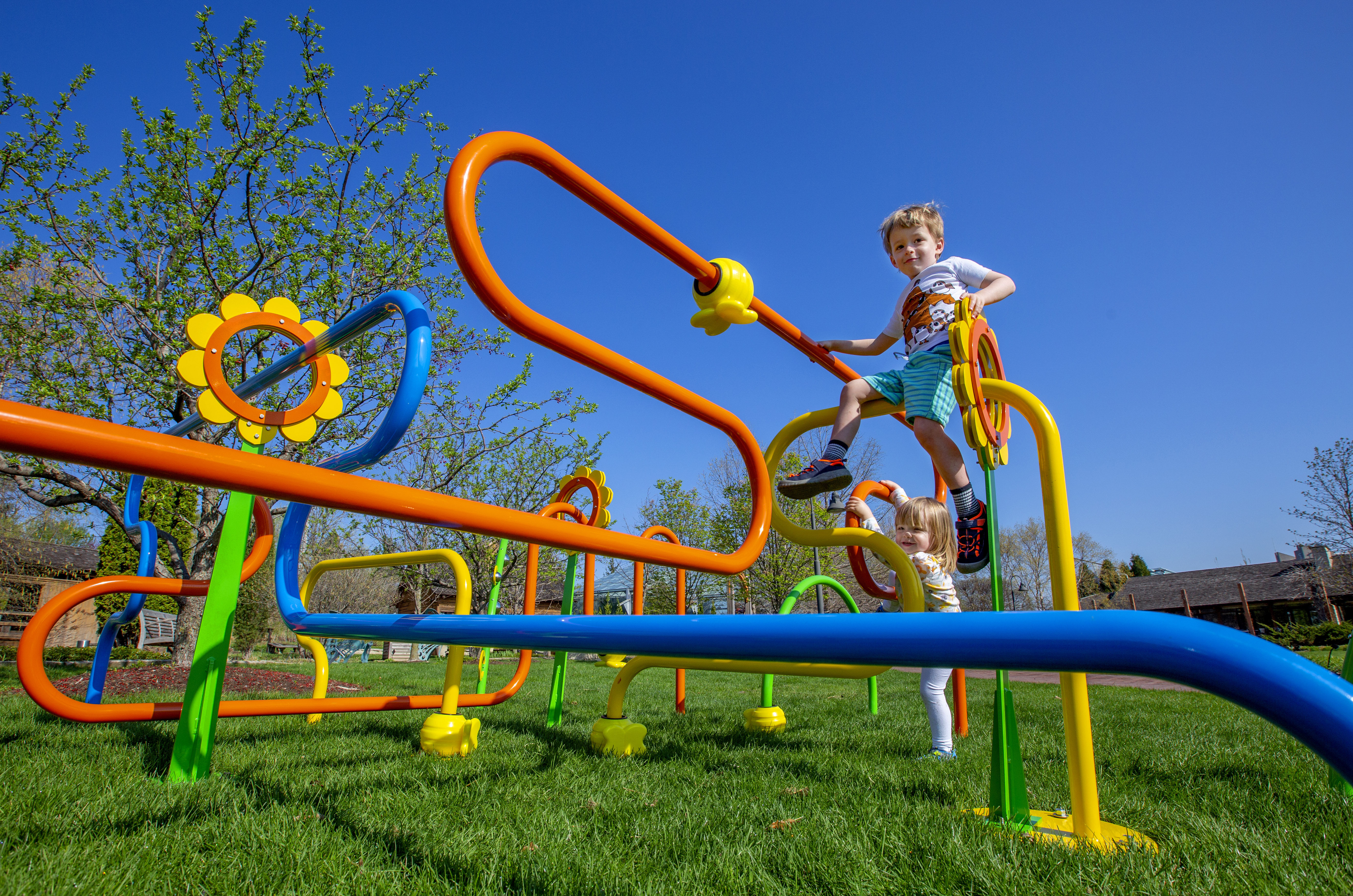 Four-year-old Bruno Kimble of Ames and his sister, Isabel, 2, relish climbing on 
