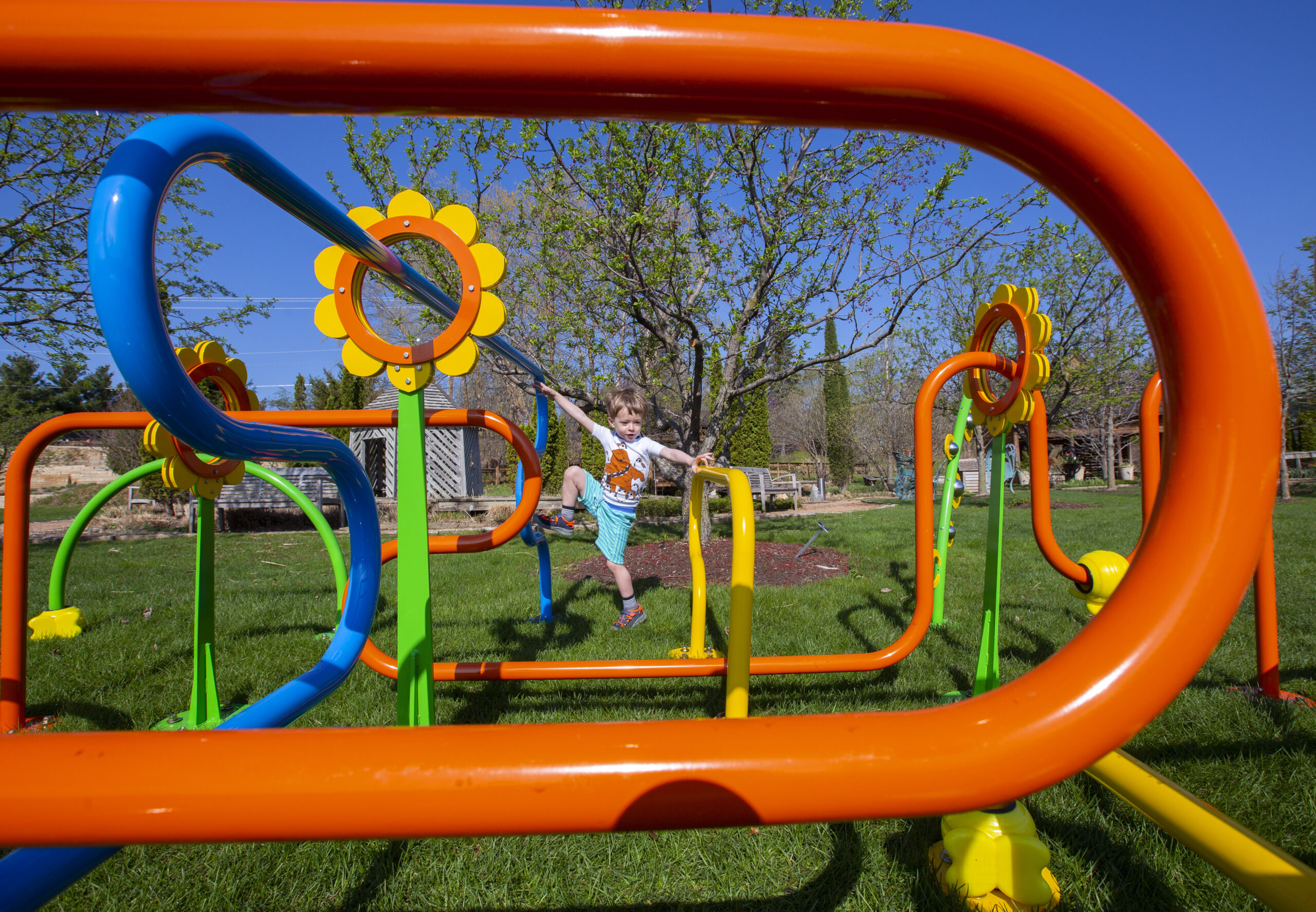 Four-year-old Bruno Kimble of Ames relishes climbing on 